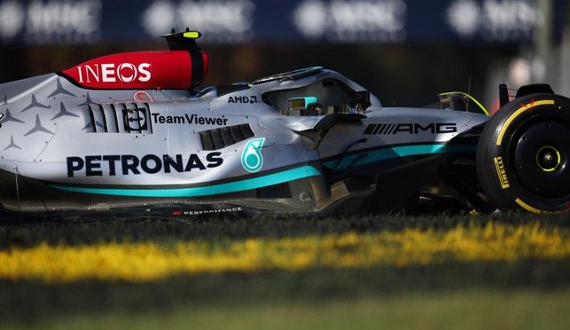 Multiple sponsors logo along the Mercedes-AMG F1 car