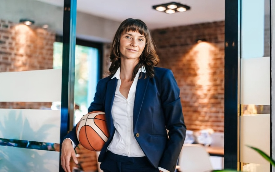 sports business - women with basketball in office